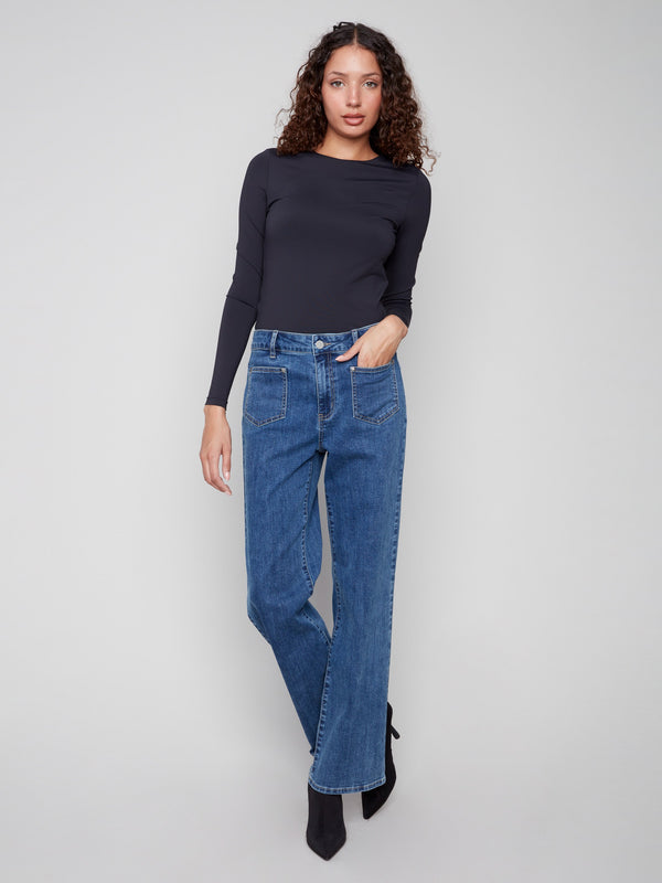 Medium blue jeans featuring a stylish flare leg and patch pockets, crafted in stretch denim for comfort by Charlie B.