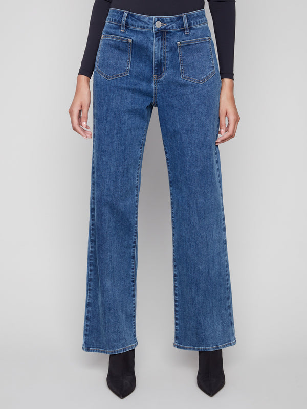 Blue jeans with long length and front patch pockets, offering a flattering silhouette in stretch denim by Charlie B.