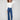 Indigo jeans with a flare leg design, featuring front patch pockets and back pockets for added style by Charlie B.