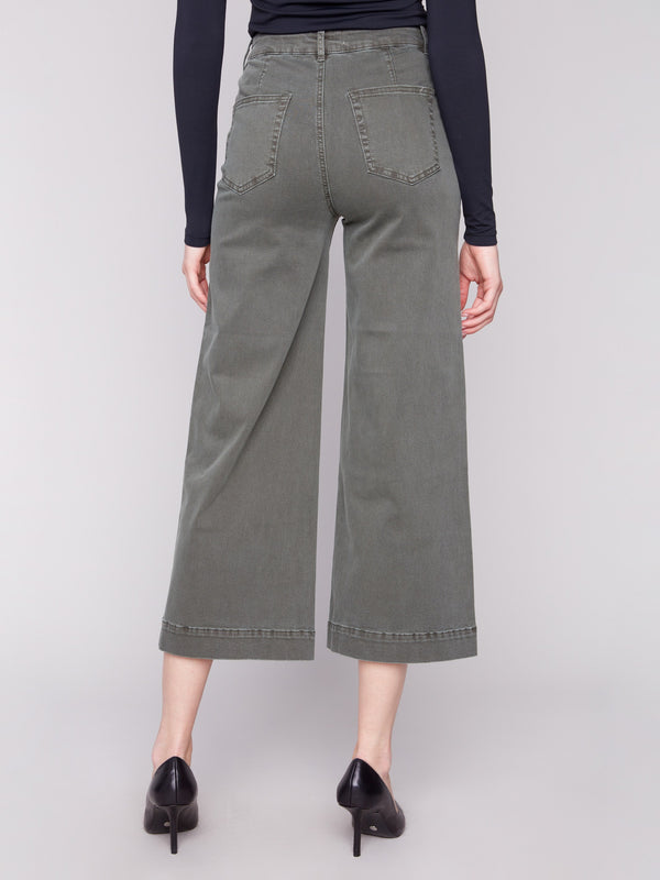Spruce-colored cropped flare pants with back pockets, combining practicality with chic style by Charlie B.