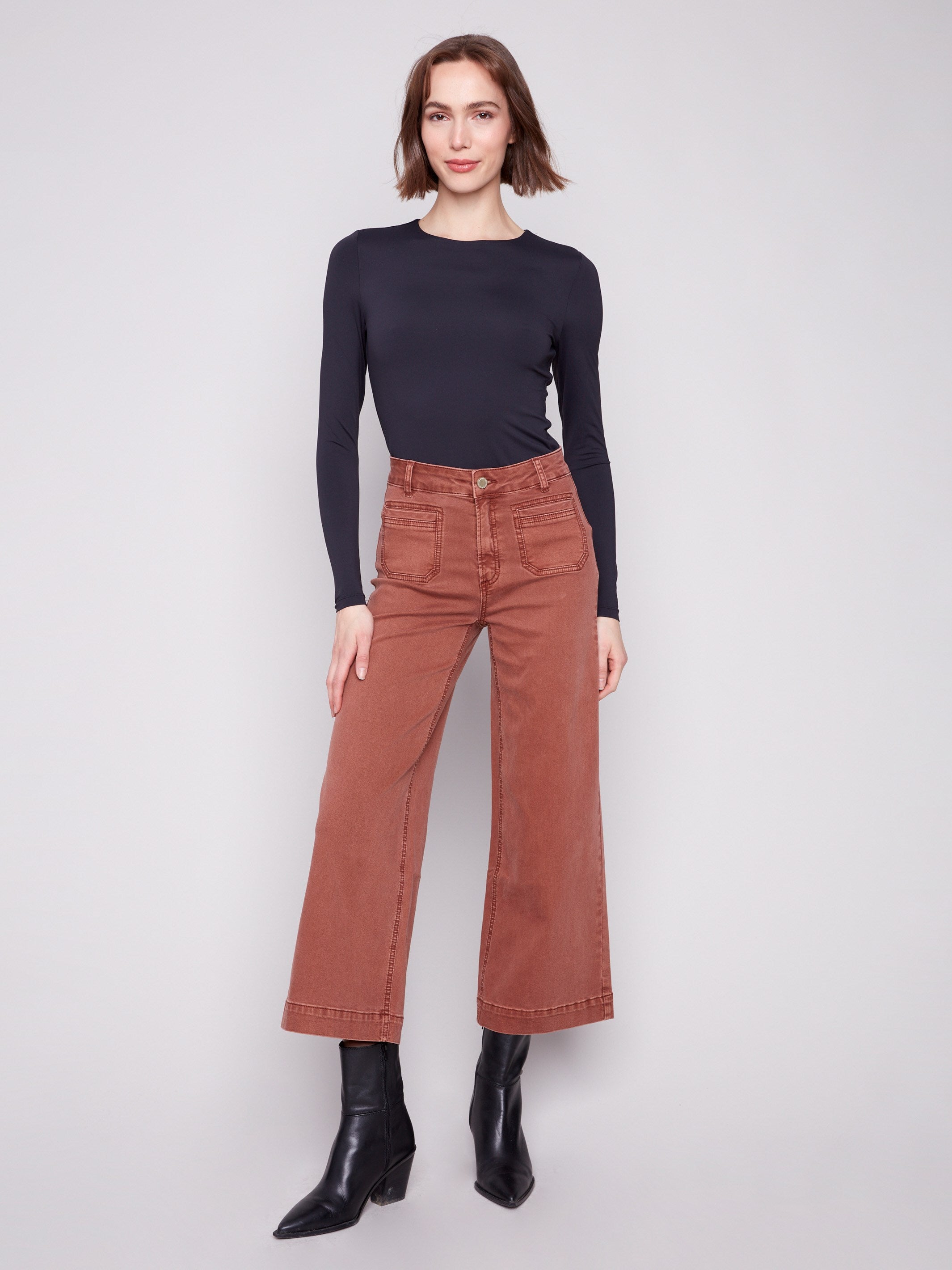 Sepia-colored twill pants featuring a comfortable flare fit and stylish design by Charlie B.