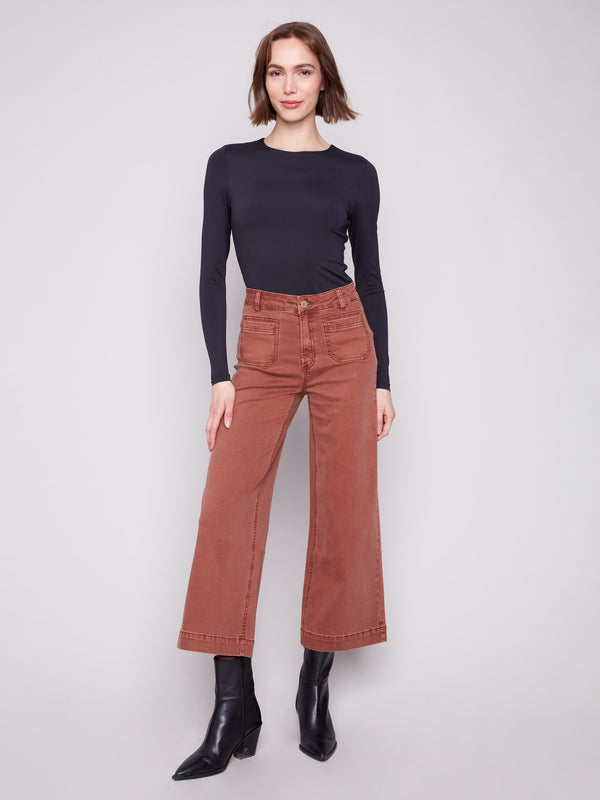 Sepia-colored twill pants featuring a comfortable flare fit and stylish design by Charlie B.