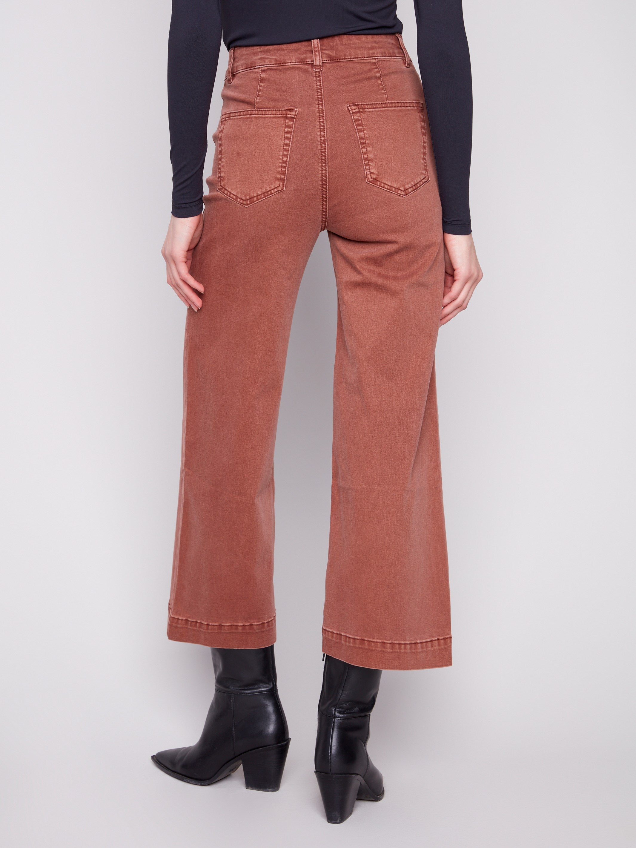 Regular rise sepia pants designed with functional back pockets by Charlie B.