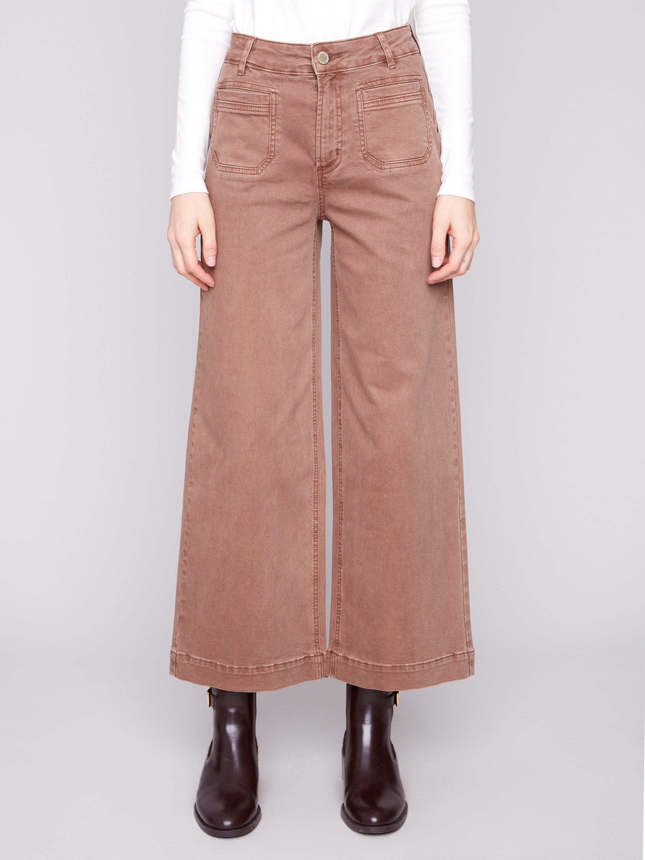 These pants boast a regular rise with front patch pockets, made from comfortable stretch twill fabric by Charlie B.