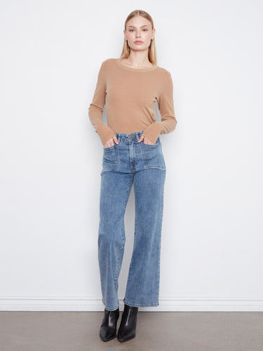 Regular rise denim jeans that offer classic style and modern comfort for everyday wear. By Charlie B.