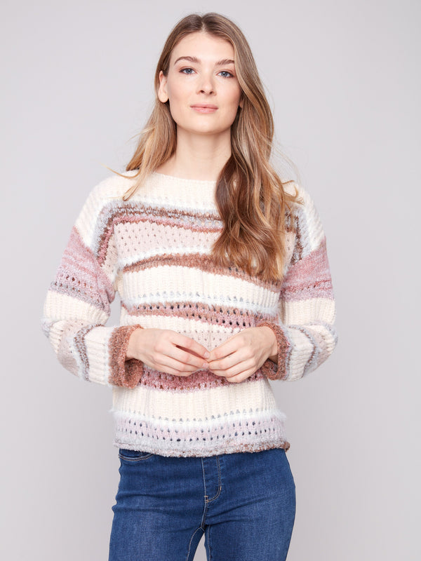 Chic striped sweater showcasing ribbed cuffs and a soft texture to keep you warm by Charlie B.