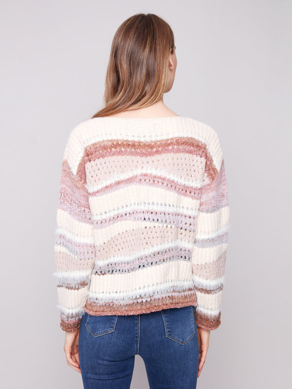 Versatile crew neck sweater with intricate patchwork detailing, adding flair to any outfit by Charlie B.