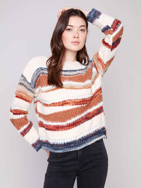 Striped patchwork knit sweater showcasing a unique drop shoulder design for a relaxed fit by Charlie B.