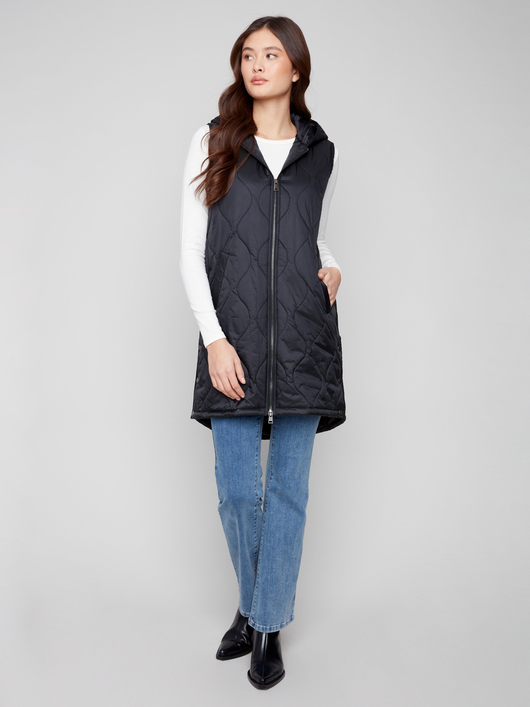 Sleek black vest showcasing welt pockets and a modern quilted look by Charlie B.