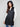 Sophisticated black quilted vest with comfortable zipper front closure by Charlie B.