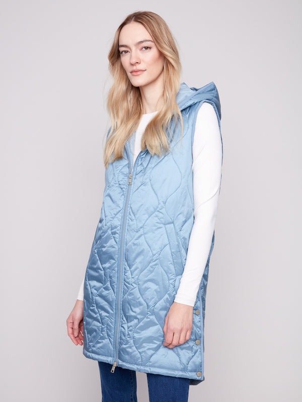Oxford hooded vest designed with functional welt pockets for convenience by Charlie B.