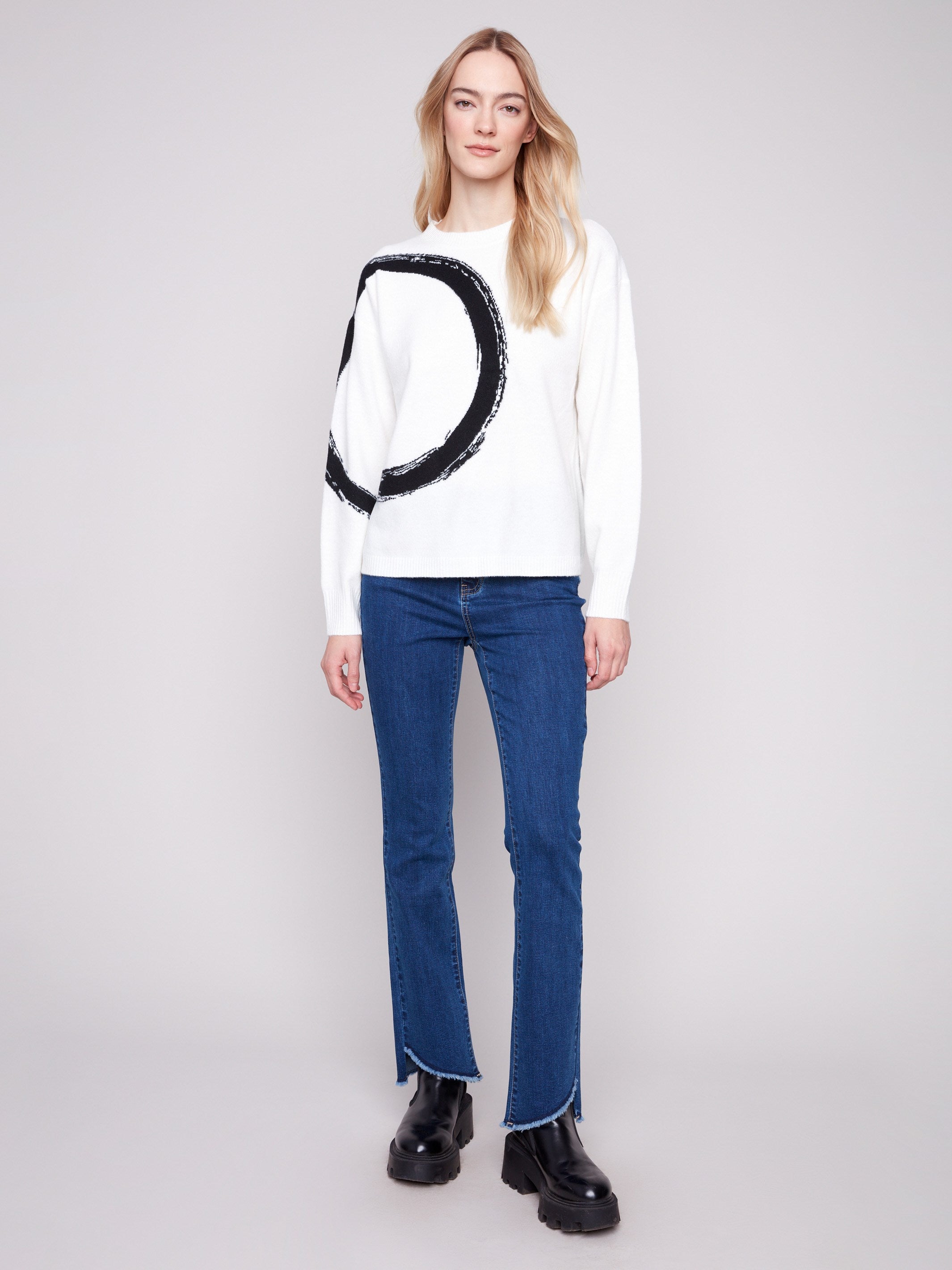 Relaxed fit ecru sweater with striking black abstract circle detail, ideal for casual wear by Charlie B.