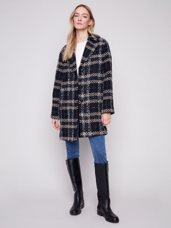 Navy plaid boucle coat featuring a tailored collar and elegant design by Charlie B.