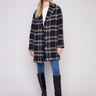 Navy plaid boucle coat featuring a tailored collar and elegant design by Charlie B.