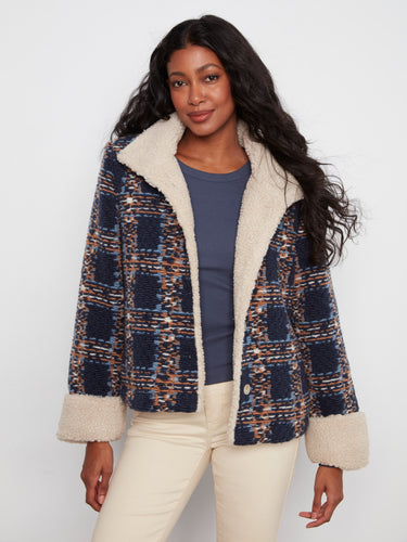 Navy plaid boucle jacket featuring a stand collar and sherpa trim, perfect for cozy style by Charlie B.