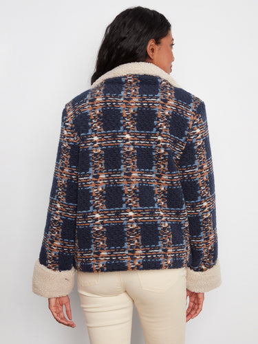 Elegant navy plaid boucle jacket with plush sherpa lining, ideal for chilly days by Charlie B.