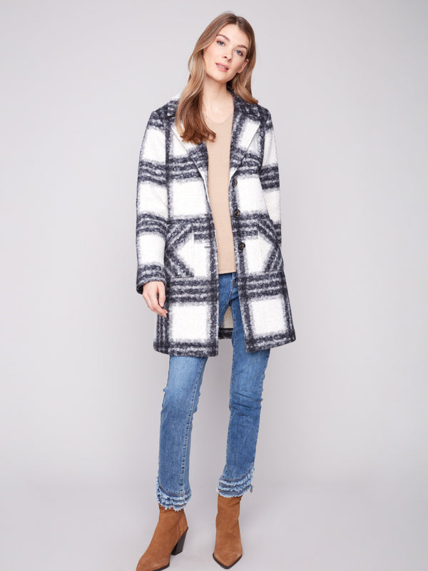 Chic black and white plaid boucle knit coat with tailored collar, adding a touch of sophistication to any outfit by Charlie B.