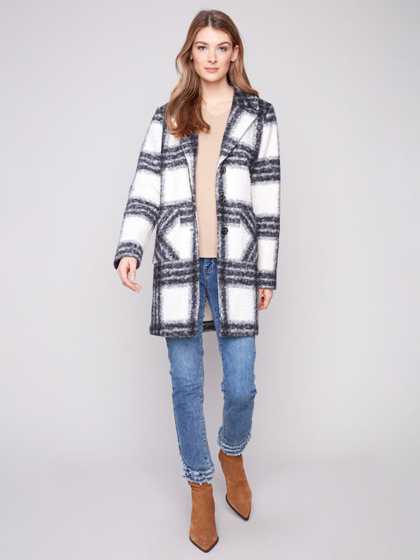Fashionable coat featuring patch pockets in a classic black and white plaid pattern, offering both style and utility by Charlie B.