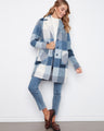 The coat features a stylish button closure, adding a touch of elegance to the overall look by Charlie B.