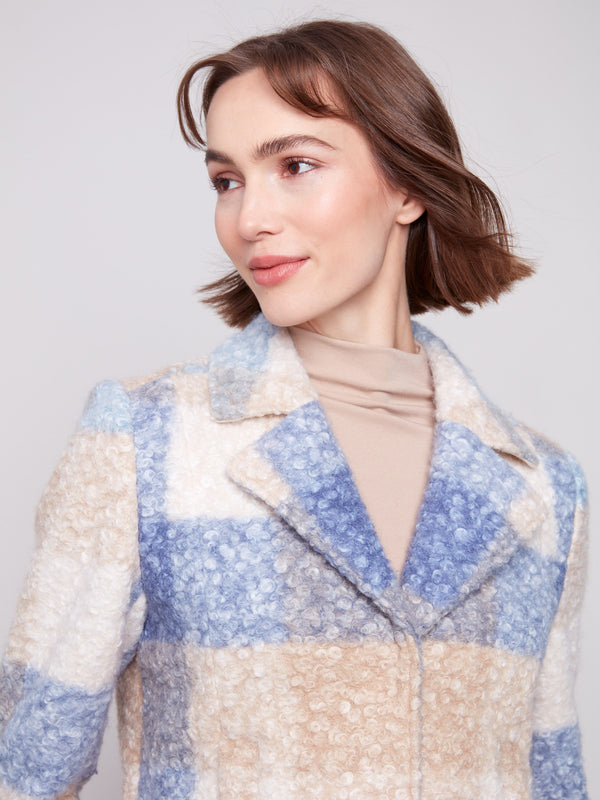 Experience the cozy bouclé knit fabric of this plaid coat in soothing blue and beige tones, ideal for any wardrobe by Charlie B.