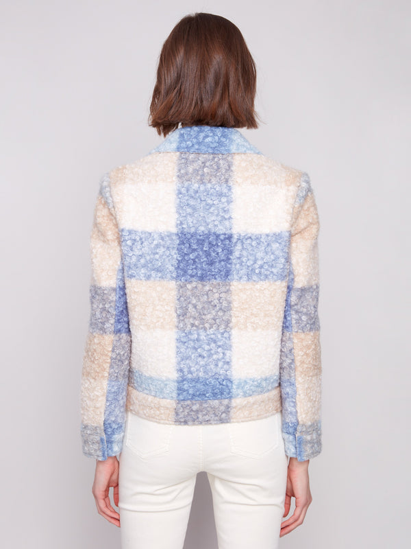 Designed with hidden snaps closure, this plaid boucle knit short coat offers a sleek finish in blue and beige hues by Charlie B.