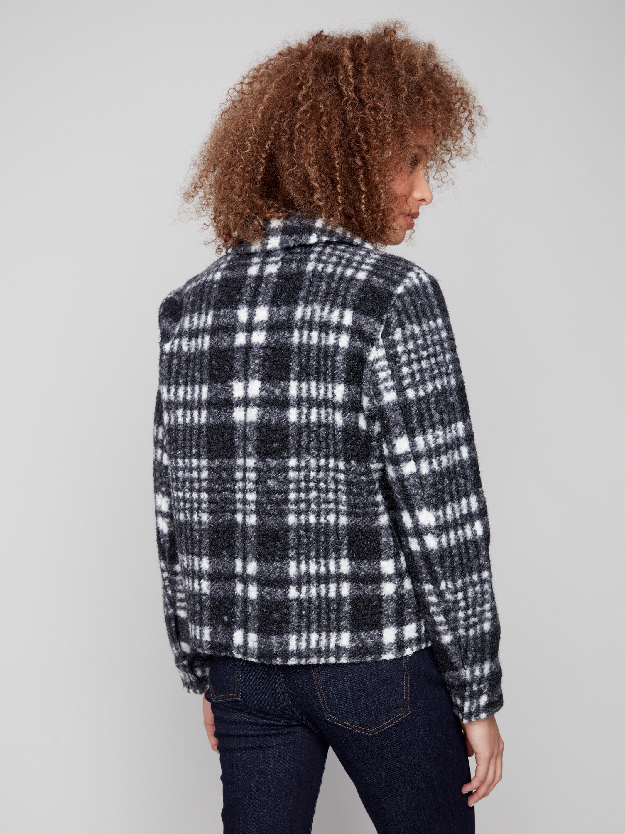 Elegant boucle knit coat with hidden snaps closure, adding subtle sophistication to your outfit by Charlie B.