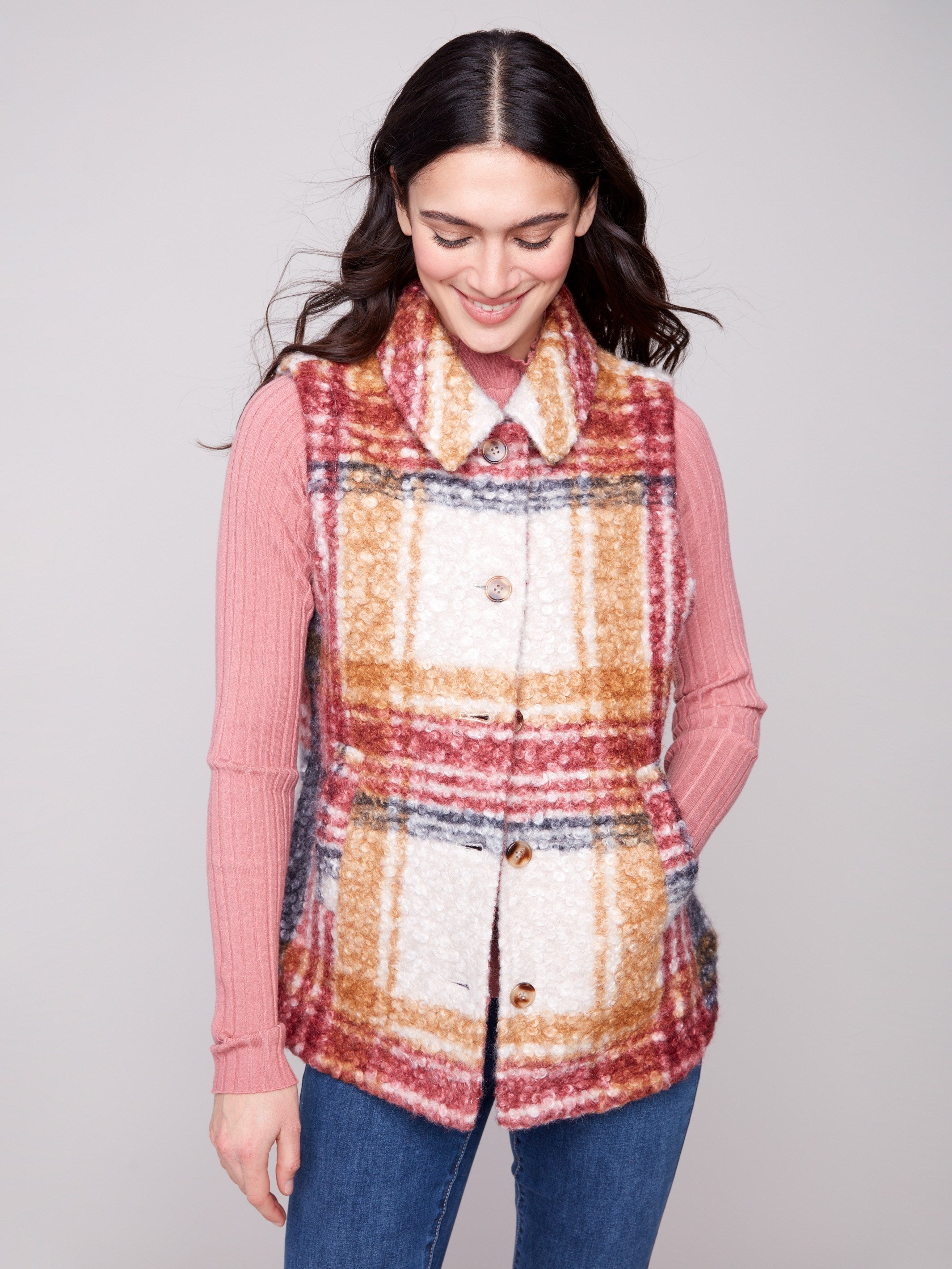 This vest features a plaid design in cabernet with welt pockets, perfect for stylish layering by Charlie B.