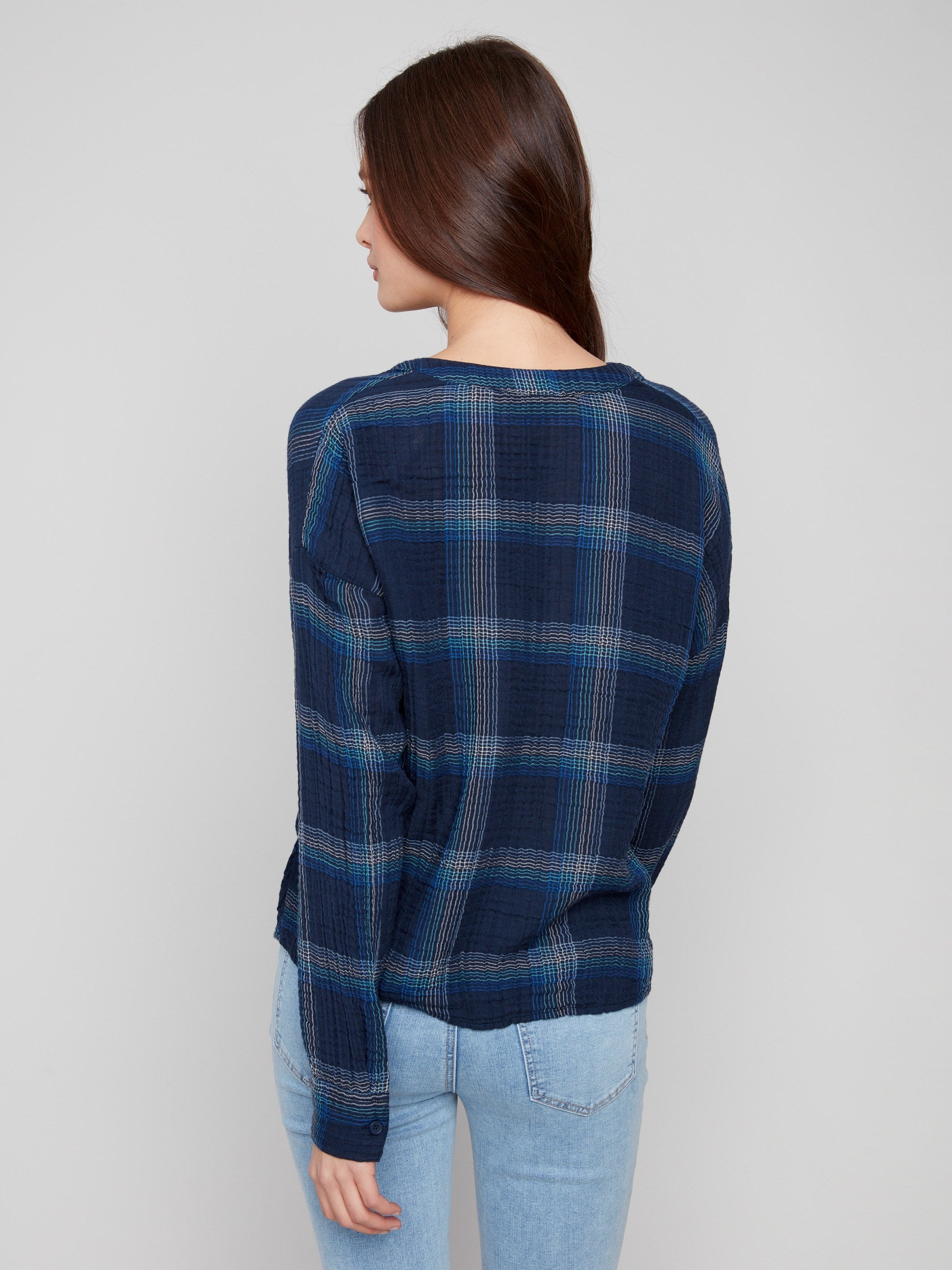 Elegant blue plaid top showcasing the unique front knot detail for added flair by Charlie B.