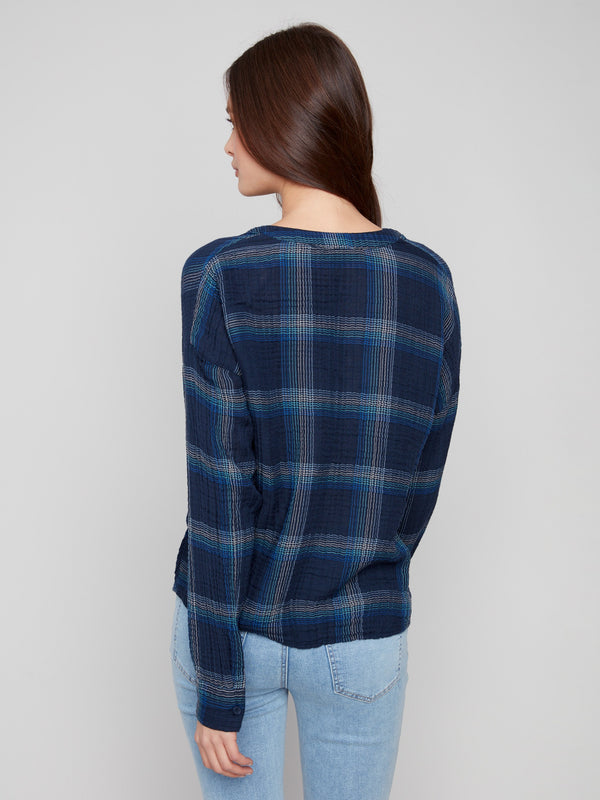 Elegant blue plaid top showcasing the unique front knot detail for added flair by Charlie B.