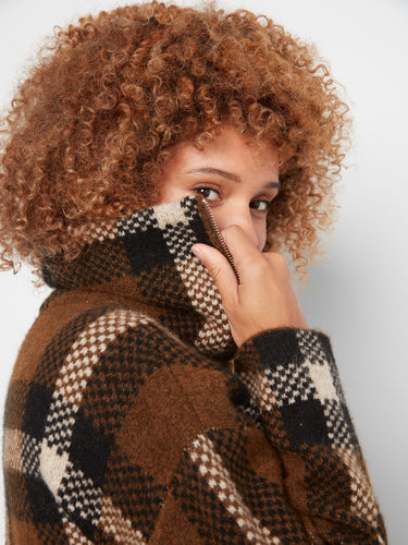 Crafted with attention to detail, this versatile piece is ideal for layering throughout the seasons. Designed by Charlie B.