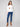 Stylish drop shoulder design on this ecru plush sweater featuring vibrant floral details by Charlie B.