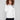 Ecru sweater showcasing intricate raglan sleeves and plush texture, perfect for a cozy look by Charlie B.