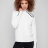 Ecru sweater showcasing intricate raglan sleeves and plush texture, perfect for a cozy look by Charlie B.