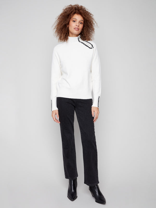 Cozy ecru sweater with plush texture and detailed stitch work, ideal for a chic winter ensemble by Charlie B.
