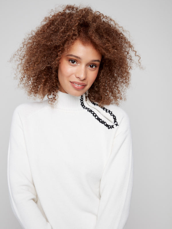 Stylish ecru sweater with luxurious plush texture and distinctive zipper detail on the collar by Charlie B.