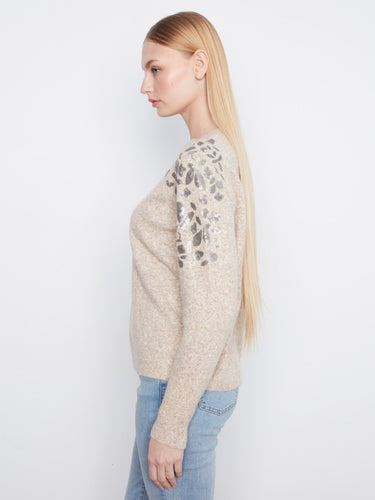 Designed with long sleeves, this cozy sweater offers warmth and style, making it ideal for cooler weather by Charlie B.