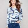 Blue swirl sweater featuring a V-neck design and long sleeves for a stylish look by Charlie B.
