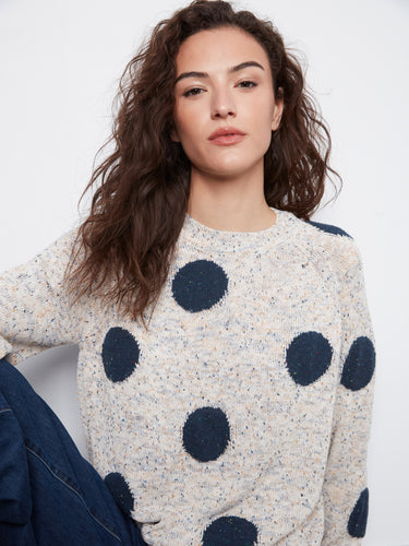Sweater featuring large navy polka dots and a cozy crew neck design by Charlie B.
