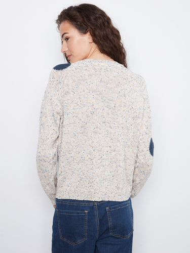 Navy dot-adorned white sweater crafted from soft speckled knit fabric by Charlie B.