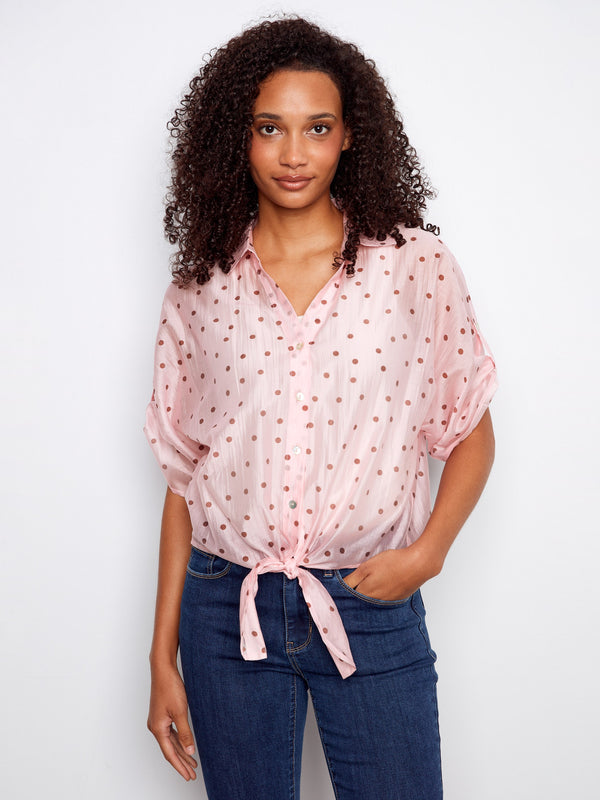Polka dot blouse with a charming front tie knot, adding a playful touch to your outfit. Perfect for casual outings by Charlie B.
