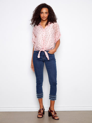 Featuring short dolman sleeves, this polka dot blouse is designed for ease and style in every movement by Charlie B.