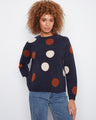 Navy sweater with crew neckline and playful oversized polka dots, perfect for a cozy day out by Charlie B.