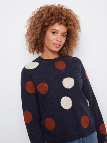 Stylish navy sweater featuring a jacquard design with charming polka dots and ribbed detailing by Charlie B.