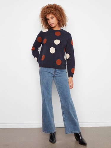 Chic navy sweater adorned with vibrant polka dots, offering a unique texture and comfortable fit by Charlie B.