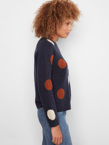 Elegant navy sweater showcasing raglan sleeves and colorful oversized polka dots for a trendy look by Charlie B.
