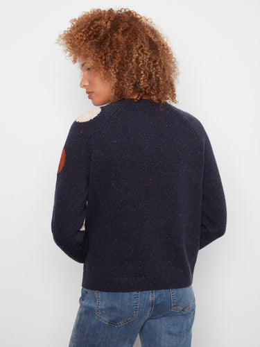 Classic navy sweater with ribbed cuffs, adding flair to the multicolored polka dot pattern by Charlie B.