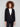 Chic black blazer featuring practical flap pockets, combining style and functionality effortlessly by Charlie B.