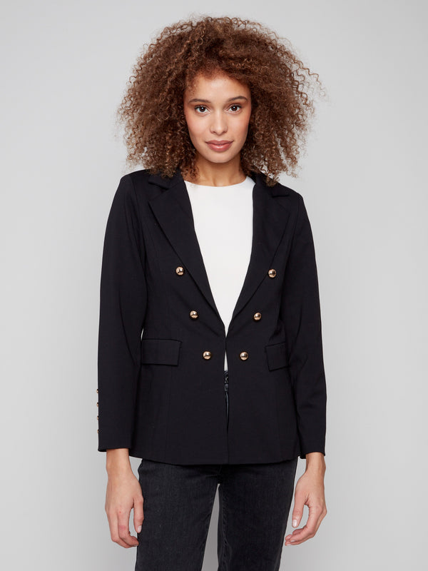 Chic black blazer featuring practical flap pockets, combining style and functionality effortlessly by Charlie B.
