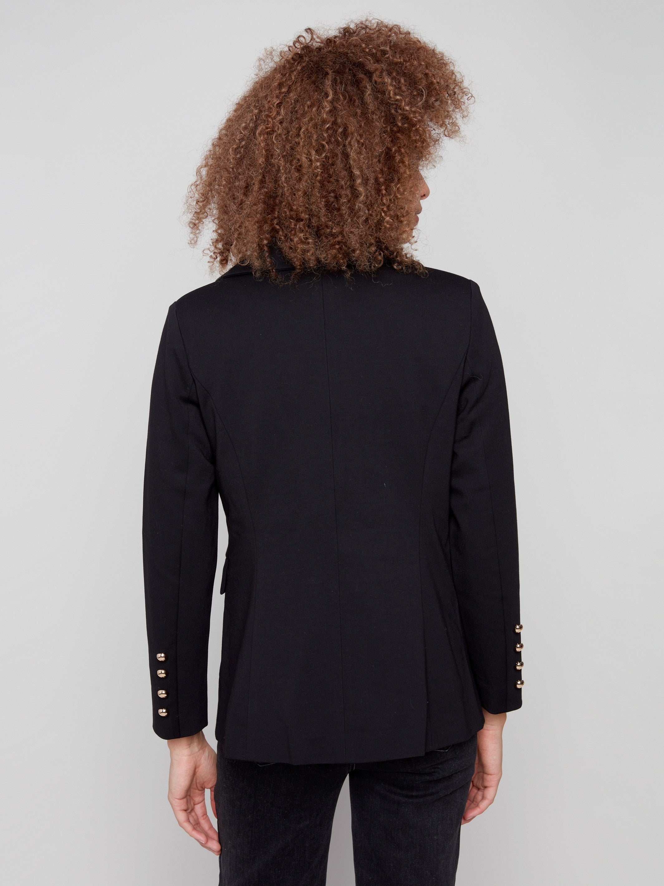 Classic black blazer designed with a refined notch lapel collar for timeless elegance by Charlie B.