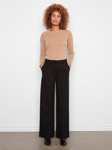 These pants feature a wide leg design, offering a stylish and comfortable fit for any occasion. By Charlie B.